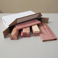 Wooden blocks with a cardboard box on a gray surface