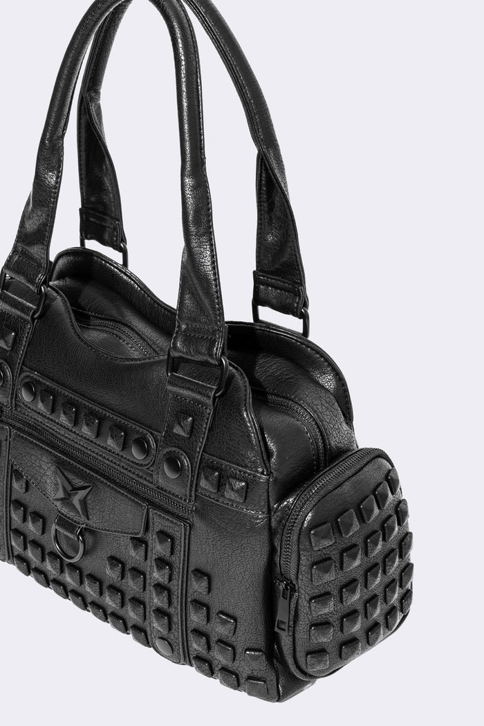 Black faux leather shoulder bag with pyramid studs, front zip pocket, side pockets and two top handles.