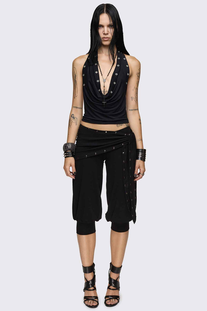 Black capri pants with wrap overskirt tie detail, silver studs, balloon fit and elasticated cuffs.