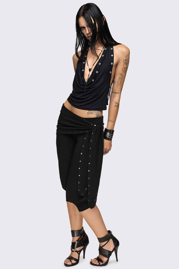 Black capri pants with wrap overskirt tie detail, silver studs, balloon fit and elasticated cuffs.