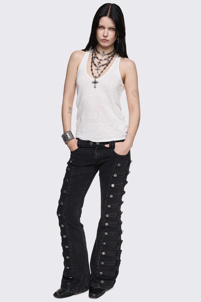 Black washed denim flare jeans with drummer-style button panels and military detailing in a dark grunge vibe.