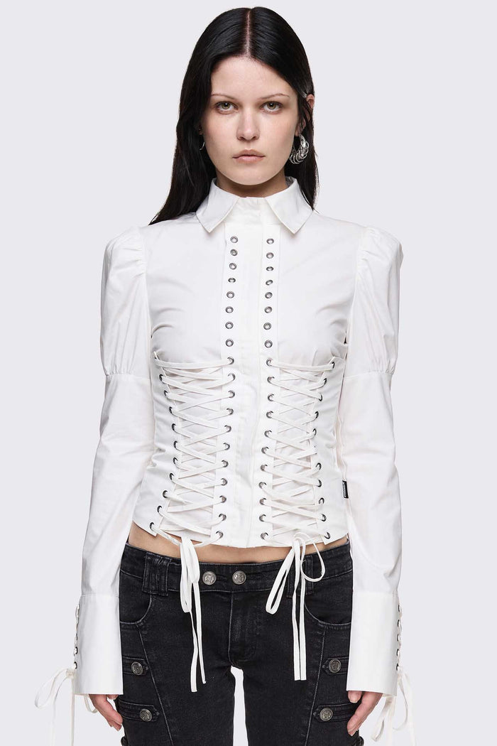 White cotton shirt with corset lace-up panels, puffed shoulders and eyelet details in a whimigoth style.