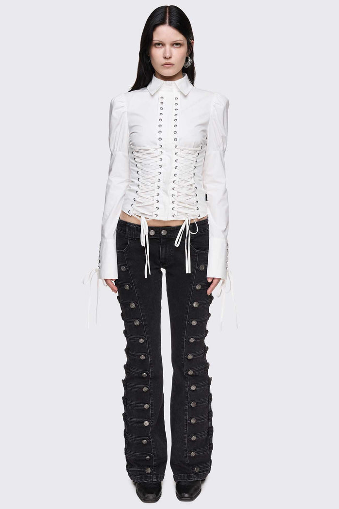 White cotton shirt with corset lace-up panels, puffed shoulders and eyelet details in a whimigoth style.