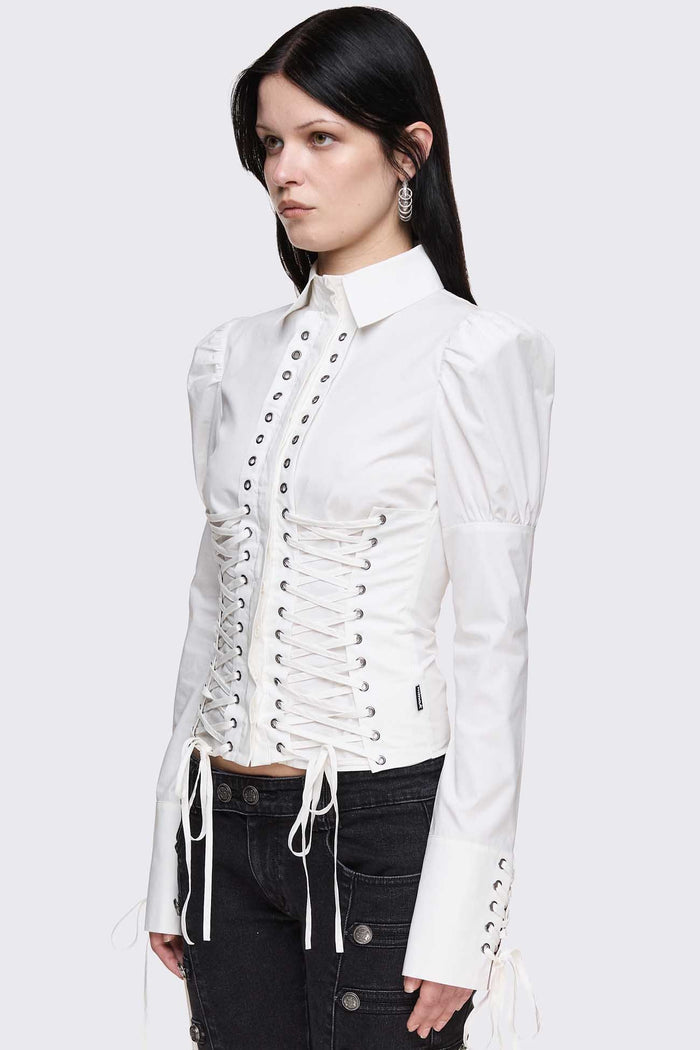 White cotton shirt with corset lace-up panels, puffed shoulders and eyelet details in a whimigoth style.