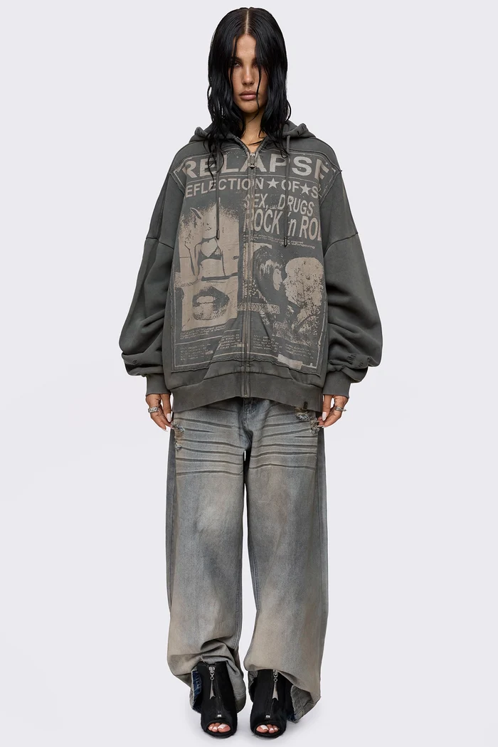 Grey washed zip up hoodie with Relapse graphic print, distressed details and oversized fit on model.