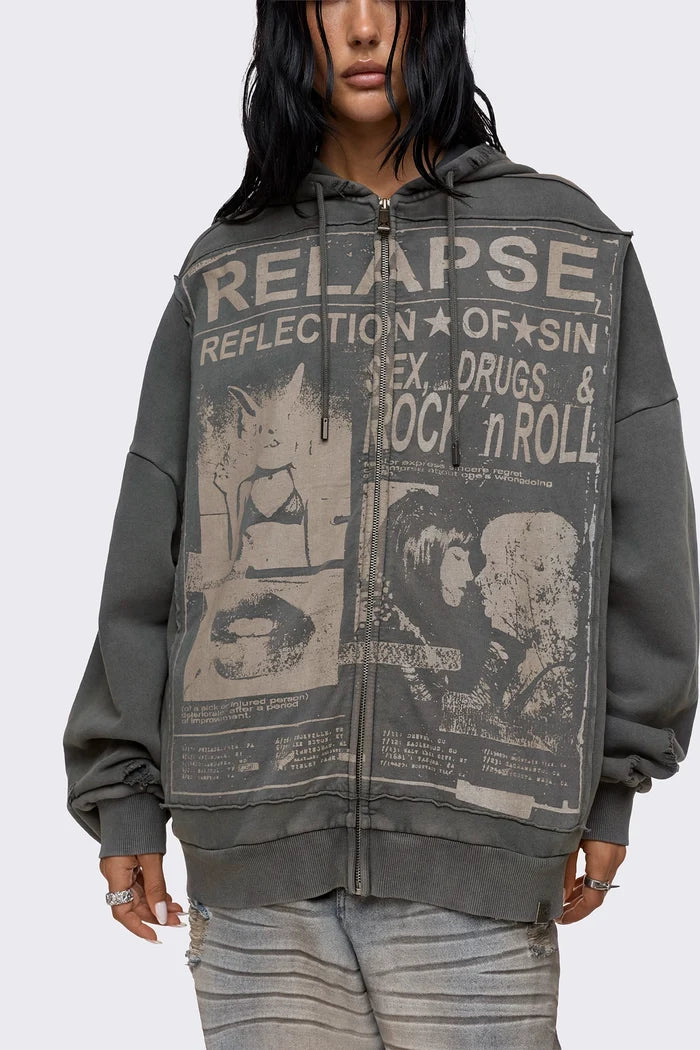 Grey washed zip up hoodie with Relapse graphic print, distressed details and oversized fit on model.