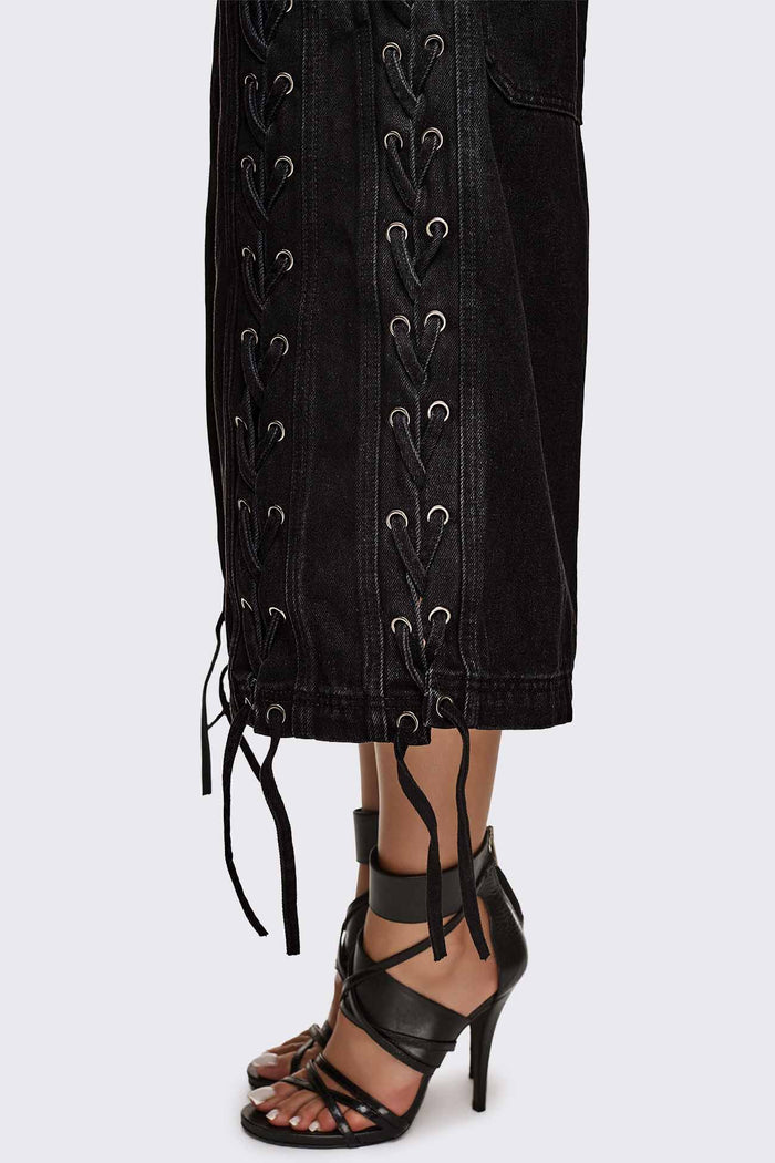 Black washed denim jorts with lace-up corset sides, baggy wide-leg fit and grunge aesthetic.