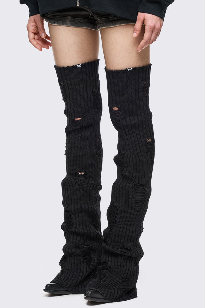 Black rib-knit thigh-high leg warmer with shredded distressed details in a grunge style.