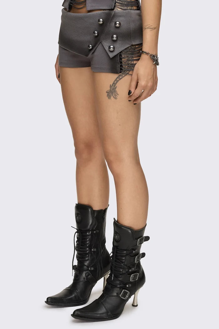 Grey washed jersey hot pants with side cutouts, silver chains and a studded fold-over low rise waistband.