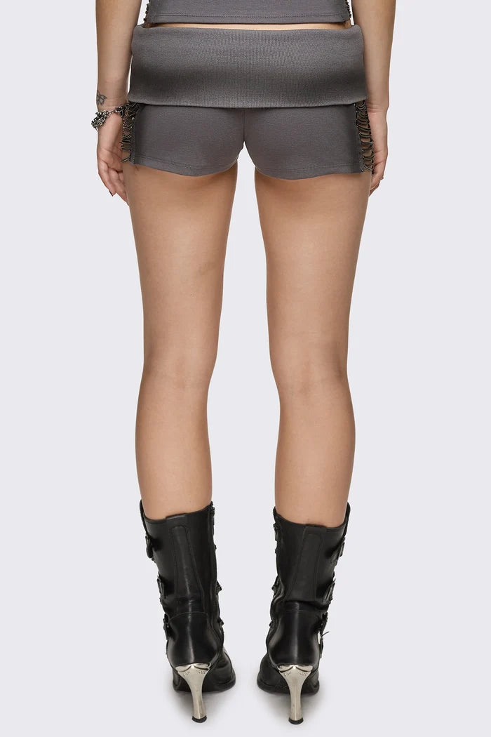 Grey washed jersey hot pants with side cutouts, silver chains and a studded fold-over low rise waistband.